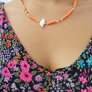 Heschi pearl orange surfer necklace