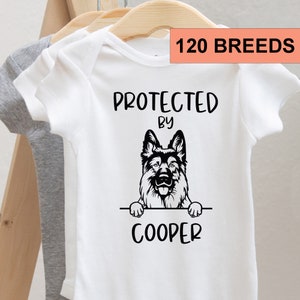 Protected by Dog Onesie®, Newborn Outfit, Custom Baby Shower Gift, Custom Dog Breed Onesie®, Personalized Dog Name Baby T-shirt