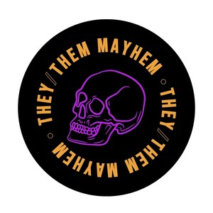 May include: A black and white circular sticker with a purple skull graphic and the text "They/Them Mayhem" repeated around the edge.