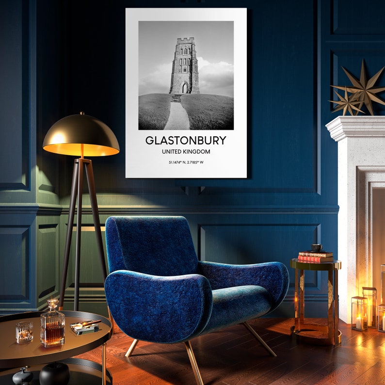 May include: Black and white photograph of Glastonbury Tor, a historic tower in Glastonbury, United Kingdom. The image is printed on a white background with the text "Glastonbury, United Kingdom, 51.1674&deg; N, 2.7189&deg; W".