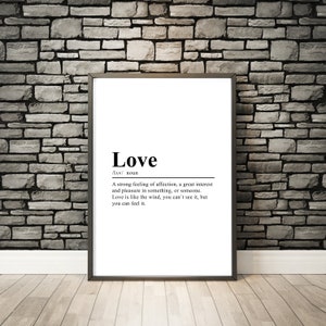 May include: A black and white printable wall art print with the word "Love" defined as a strong feeling of affection, a great interest and pleasure in something, or someone. The definition continues, "Love is like the wind, you can't see it, but you can feel it."