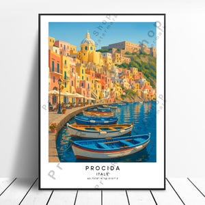 May include: A framed art print depicting Procida, Italy, with vibrant buildings and blue boats on the water. The print includes the text "PROCIDA ITALY" and geographical coordinates. The artwork is set against a clear blue sky.