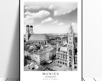 May include: Black and white photograph of the Munich skyline, featuring the Frauenkirche and the New Town Hall. The text "MUNICH GERMANY 48.1351° N, 11.5820° E" is at the bottom of the image.