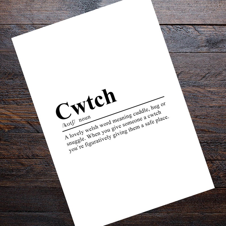 May include: A black and white printable definition of the Welsh word "cwtch" which means cuddle, hug, or snuggle. The definition explains that giving someone a cwtch is like giving them a safe place.