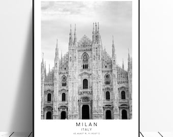 May include: Black and white photograph of the Duomo di Milano, a large cathedral in Milan, Italy. The text "MILAN ITALY 45.4642° N, 9.1900° E" is printed below the image.