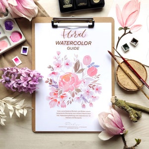 May include: A watercolor guide with a floral illustration of pink and purple flowers. The guide includes instructions for creating wreaths and bouquets.