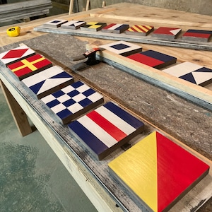 Custom Nautical Flag Sign – Handcrafted wood decor, personalized with names or messages. Perfect for beach houses, boats & homes!