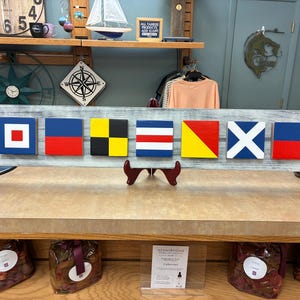 Nautical flag signs personalized navy marine signal flag letters each flag represents a letter from the alphabet custom name flag signs