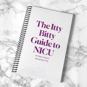 May include: A white spiral-bound book titled "The Itty Bitty Guide to NICU" in purple text. The author's name and credentials are listed below the title. The book is on a white and gray marble patterned surface.