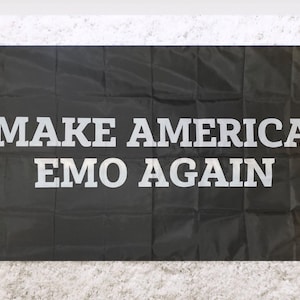 May include: Black flag with white text that reads "MAKE AMERICA EMO AGAIN".
