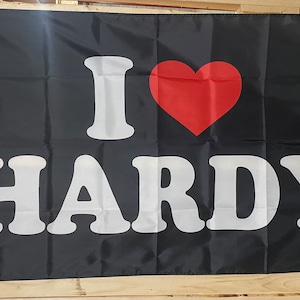 May include: A black flag with white text that reads "I love Hardy" and a red heart.