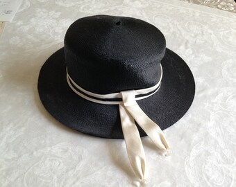 Vintage, black and white, ladies hat with ribbon on wide brim