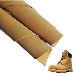 May include: Two rolls of tan leather, a material often used for crafting boots, shoes, and other leather goods. A pair of tan leather boots with black laces and a black trim around the top of the boot.