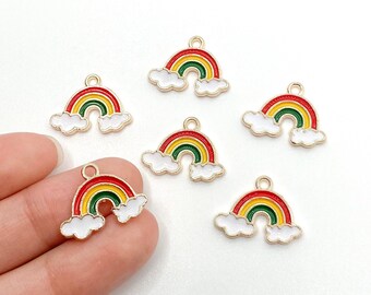 May include: Six gold-tone rainbow charms with white clouds. Each charm features a red, yellow, and green rainbow.