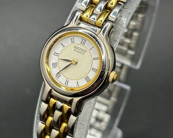 Vintage Seiko 1N00-0C59 Two Tone Gold Silver Floral Dial Roman Numerals Women’s Dress Quartz Watch