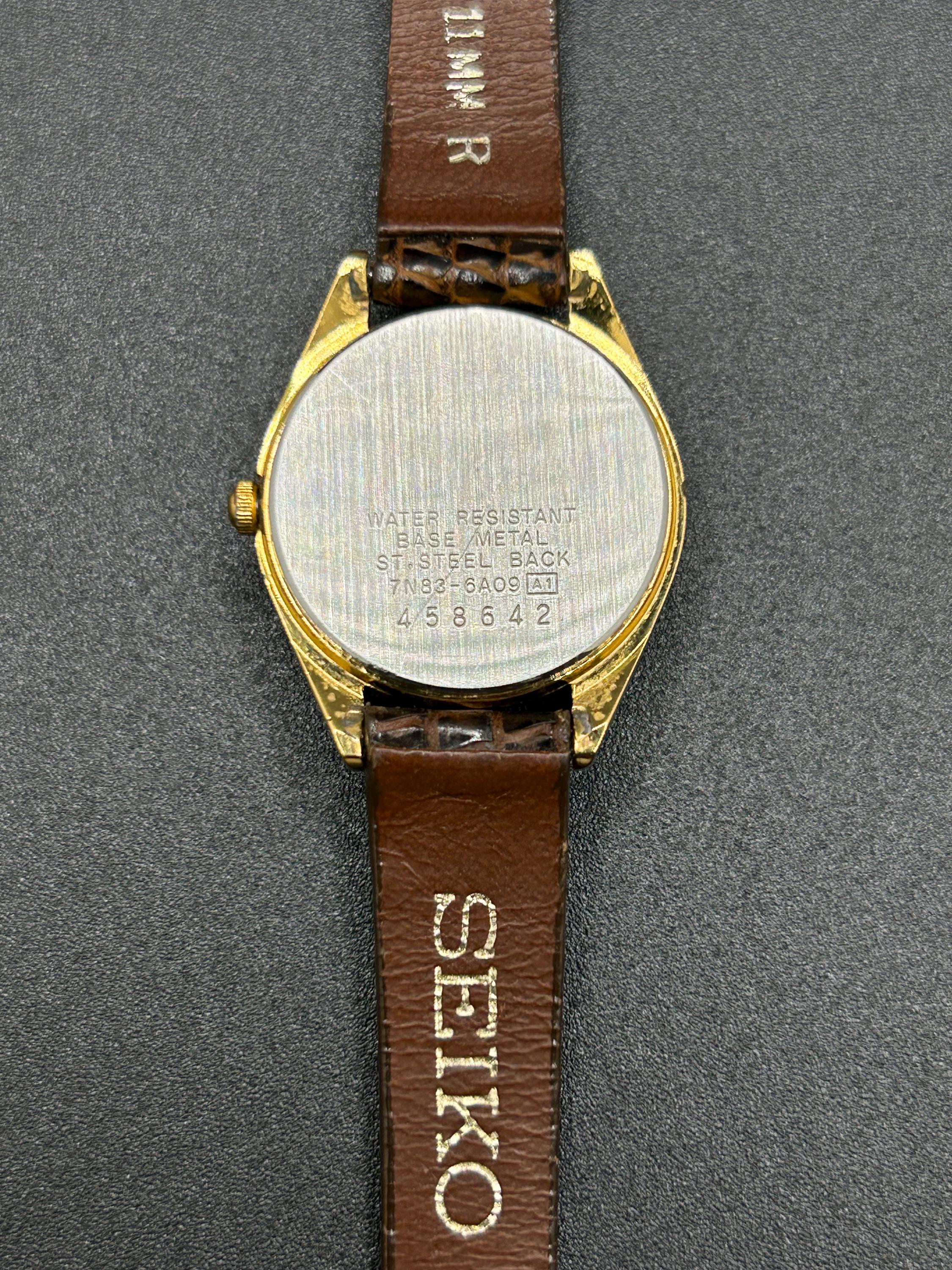 Vintage Seiko 7N83-6A09 Gold Tone Women's Quartz Watch With Day