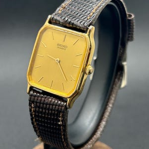 Vintage Seiko 6530-5770 Gold Tone Rectangular Dial Brown Leather Strap Men’s Quartz Dress Watch