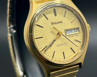 Vintage Bulova Dual-Day Gold Tone Bracelet Day Date Dial Swiss Made Men’s Quartz Watch