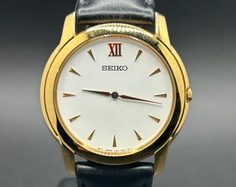 Vintage Seiko Quartz 7N00-0AH0 Gold Tone Case White Dial Minimalist Classic Men’s Dress Watch