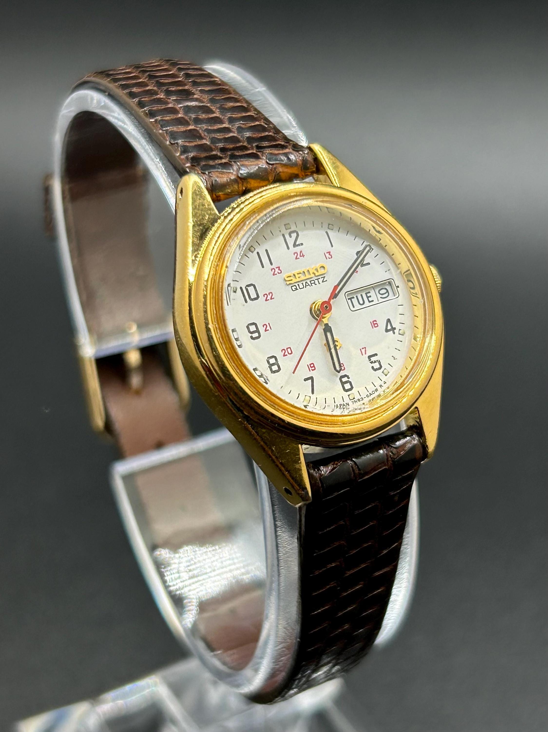 Vintage Seiko 7N83-6A09 Gold Tone Women's Quartz Watch With Day