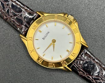 Vintage Bulova Gold Tone Roman Numeral White Dial With Leather Strap Women’s Quartz Watch