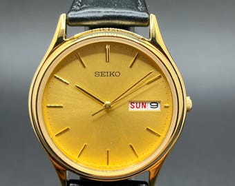 Vintage 1990s Seiko 7N43-8A99 Gold Sunburst Dial Day Date 34.5mm Men’s Gold Tone Quartz Watch