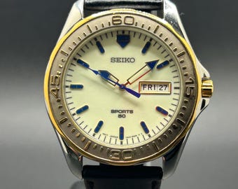 Reloj de cuarzo para hombre Seiko Sports 50 vintage de los años 90 con esfera bicolor, fecha, día, día, fecha, luminiscencia completa y bisel fijo de 42,5 mm - 7N43-8B20