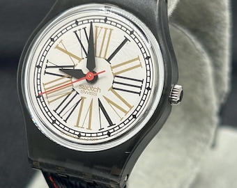 Reloj de cuarzo unisex coleccionable Swatch vintage suizo clásico con esfera de números romanos y caja negra, estilo retro de los años 80 y 90.