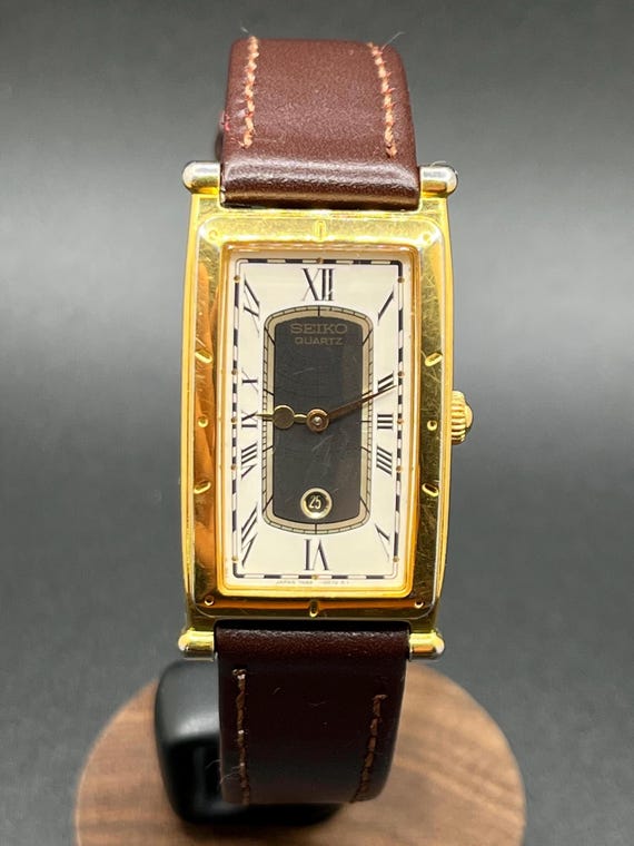 Vintage Rare 1990s Seiko Age of Discovery 7N89-5009 Tank Gold Tone Roman Dial Date Quartz Men’s Watch