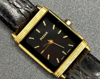 Vintage Pulsar By Seiko V701-X043 Women’s Tank Style Quartz Watch With Black Dial and Gold Tone Case