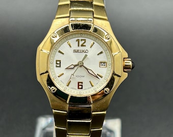 Vintage Seiko Gold Tone Women’s Quartz Watch 7N82-0BE0 With Date Display And Sapphire Crystal
