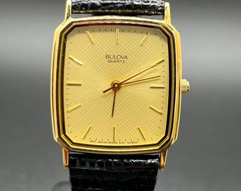 Vintage Bulova Men’s Tank Style Quartz 1985 Gold Tone Slim Dress Textured dial Classic Minimalist Watch 27mm