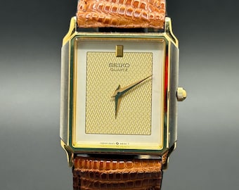 Reloj de cuarzo fino de vestir de 26 mm para hombre, modelo vintage Seiko de 1985, con esfera texturizada bicolor y agujas tipo dauphine - 9020-5399