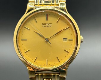 Vintage Seiko 7N22-7018 Gold Tone With Date Display Men’s Dress Quartz Watch