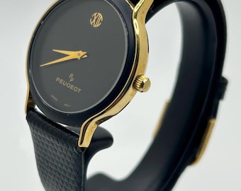Reloj Peugeot vintage minimalista de cuarzo para mujer, negro y dorado