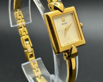 Vintage Seiko V400-6429 Gold Tone Rectangular Bangle Style Minimalist Women’s Dress Quartz Watch
