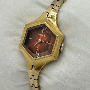 Vintage Seiko Women’s Windup Mechanical Watch 11-8029 Gold Tone Hexagonal Burgundy Red Dial With Faceted Crystal - Working