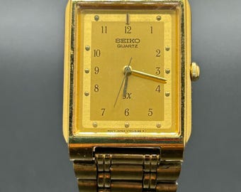 Reloj clásico Seiko Quartz SX V701-5J20 vintage, color dorado, estilo tanque, rectangular, para hombre, 23,5 mm, años 90.