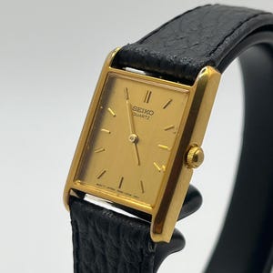Montre Tank Seiko vintage pour femme, cadran doré 18 mm, rectangle doré 1N00-5B50