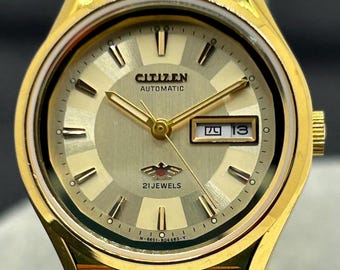 Reloj automático vintage Citizen Eagle para mujer en tono dorado: Kanji Day-Date, 21 joyas