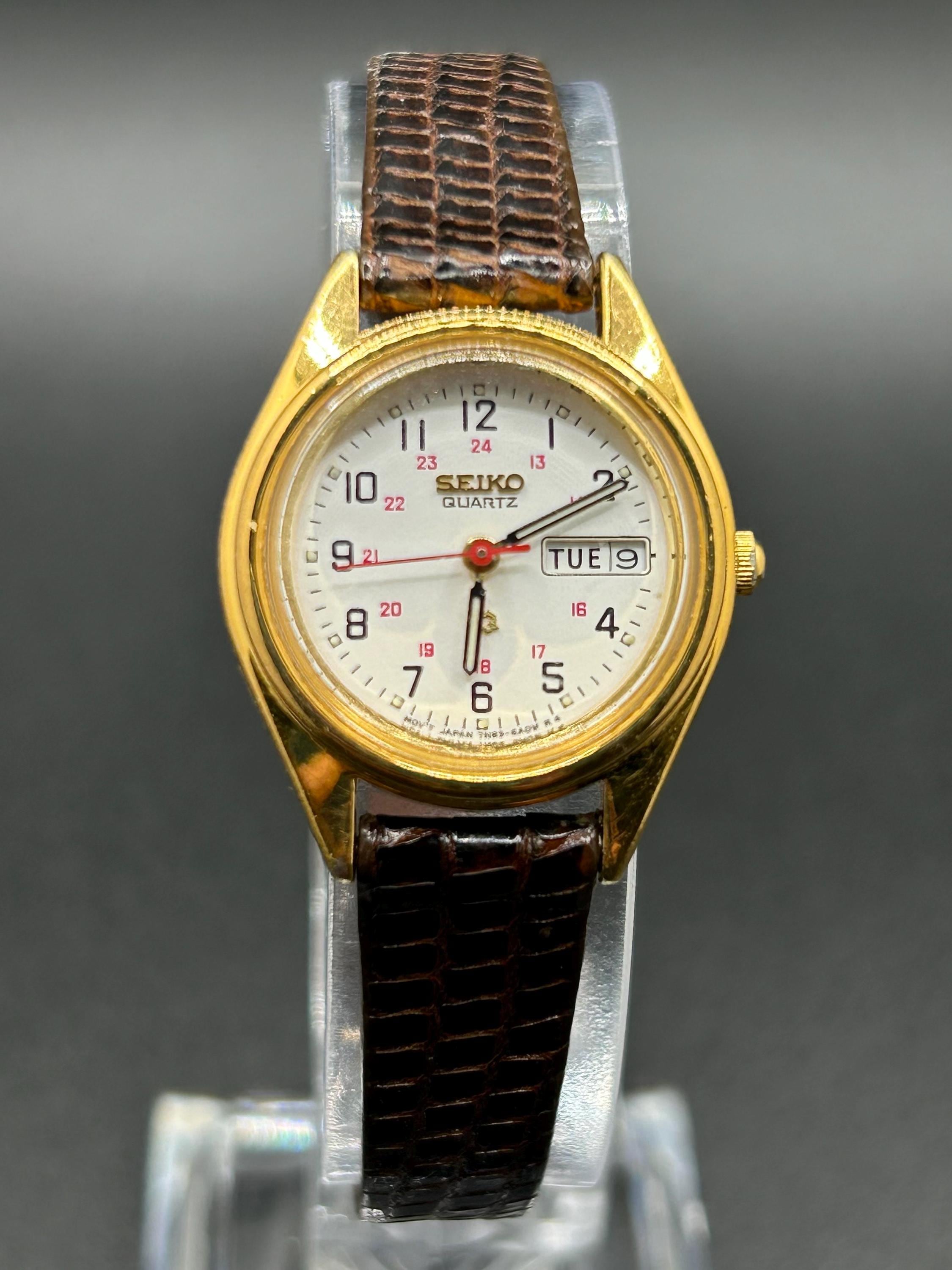 Vintage Seiko 7N83-6A09 Gold Tone Women's Quartz Watch With Day