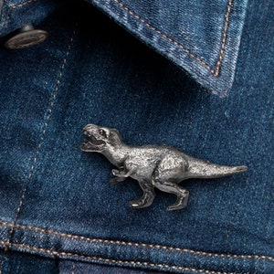 A Righteous T rex brooch