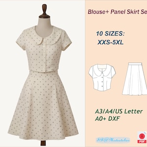 Op de afbeelding: Een crèmekleurige blouse en paneelrokset met een polkadotpatroon. De blouse heeft een ronde kraag en een knoopsluiting. De rok is een uitlopende stijl. De afbeelding bevat ook de tekst "Blouse+ Panel Skirt Set" en "10 SIZES: XXS-5XL".