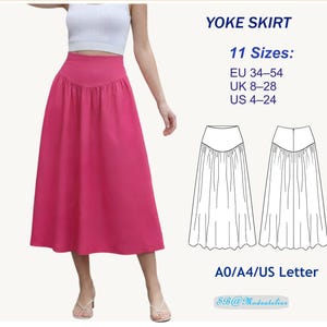 Puede incluir: Se muestra una falda rosa intenso con cintura alta y forma de línea A. La imagen incluye el texto "YOKE SKIRT" e información de tallas: tallas EU 34-54. El diseño de la falda también está ilustrado.