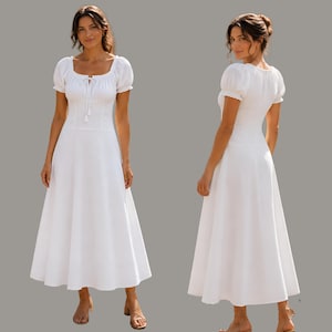 May include: A solid white midi dress featuring short puff sleeves with elasticated cuffs, a square neckline with a central drawstring tie, a fitted bodice, and a flared skirt that falls to the mid-calf. The design is shown from front and back.