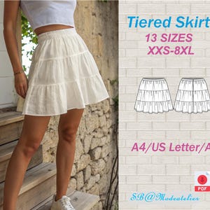 May include: A white tiered skirt with a ruffled design. The skirt is shown with a white crop top. Text on the image reads "Tiered Skirt, 13 Sizes, XXS-8XL, A4/US Letter/A0".