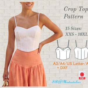 Peut inclure: Un haut court blanc avec de fines bretelles et un décolleté en cœur est associé à une jupe orange. L'image comprend également un patron pour le haut court, avec le texte "Crop Top Pattern" et "15 Tailles: XXS - 10XL".