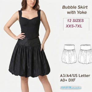 Puede incluir: Una falda abullonada negra con canesú, combinada con un top a juego. La falda tiene un diseño fruncido y voluminoso. La imagen también incluye el texto "Bubble Skirt with Yoke" y "12 SIZES XXS-7XL".