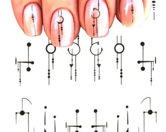 May include: A set of nail art stickers with geometric designs featuring circles, lines, and dots. The stickers are black and white and are shown on a fingernail.