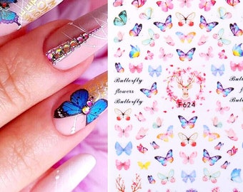 May include: Nail art stickers featuring a variety of colorful butterflies, flowers, and a deer with antlers. The stickers are on a white background and are labeled "Butterfly flowers Butterfly" and "F624".